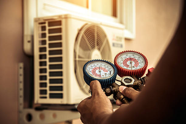 Professional Heat Pump Repair technician working in Palmyra, IN